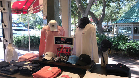 Shop in Harbour Town pink and white shirts on display in store