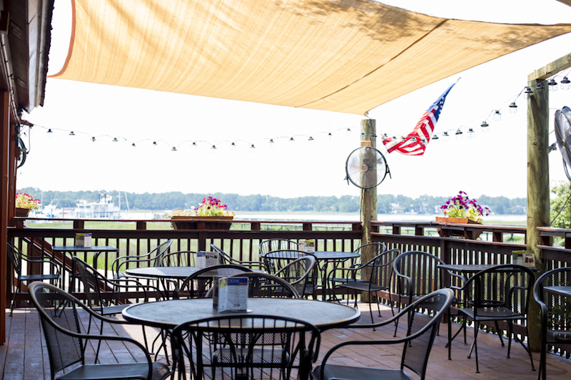 Eat Where the Locals Eat on Up the Creek's outdoor dining deck.