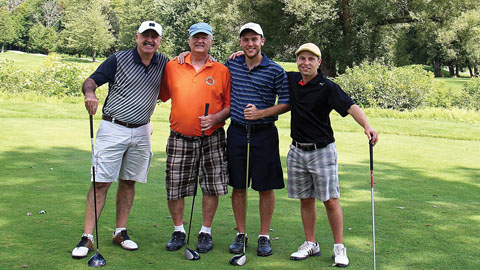 Golf is for Everyone. Four golfers posing for a picture