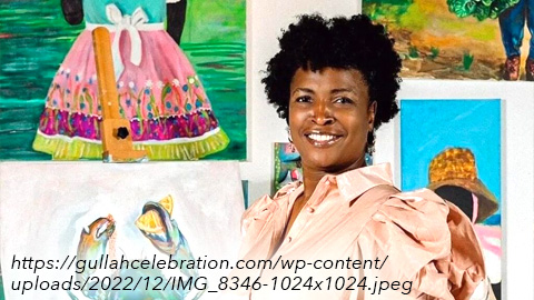 Gullah Celebration's Featured Artist woman in front of paintings
