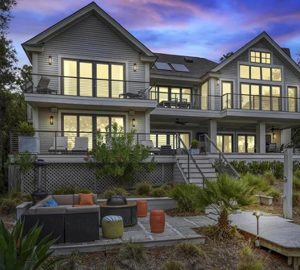 sunset rentals. large home at dusk