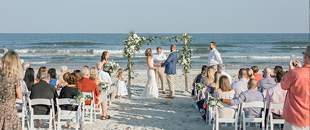 a couple getting married on the beach