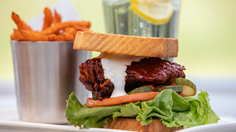 Big Jim's BBQ, Burgers, Pizza & Catering . a bbq pork sandwich with fries. BigJims_Feed