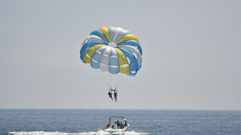 The High-Flying Joy of Parasailing. two people parasailing