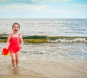 The Ultimate Family Itinerary Guide for Hilton Head Island. little girl in red bathing suit