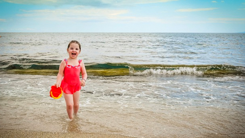 Safest Colors. little girl in red bathing suit
