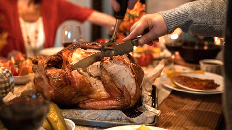 Thanksgiving Dining on Hilton Head. someone carving a turkey