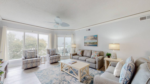 406 Windsor Place. A living room with 2 sofas and 2 recliners