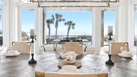Beach Properties. a dining room with windows