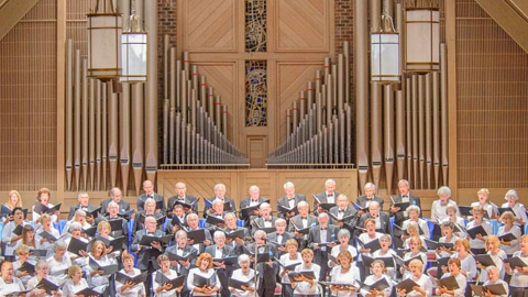 The Hilton Head Choral Society Loves Music. a choir in a church and in front of a pipe organ