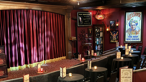 Comedy Magic Cabaret. A red room with stage