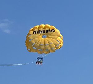 Going UP and DOWN with Island Head Parasailing. a yellow parasail