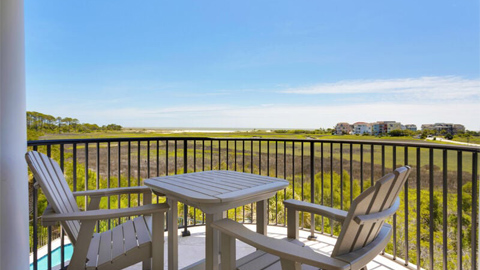 10 Singleton Shore Manor. two chairs and a table on a deck