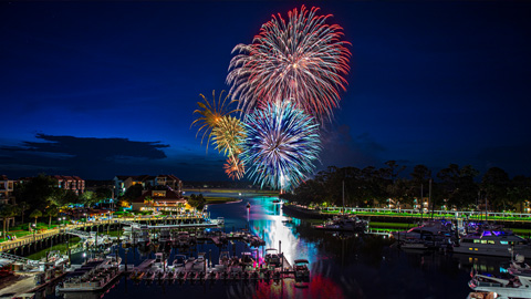 Where to See 4th of July Fireworks on Hilton Head Island in 2026. beautiful fireworks display over a marina